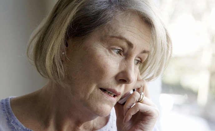 A woman talks on the phone
