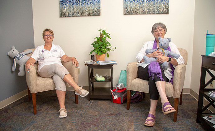 Two volunteers show the Memory Bears they have made